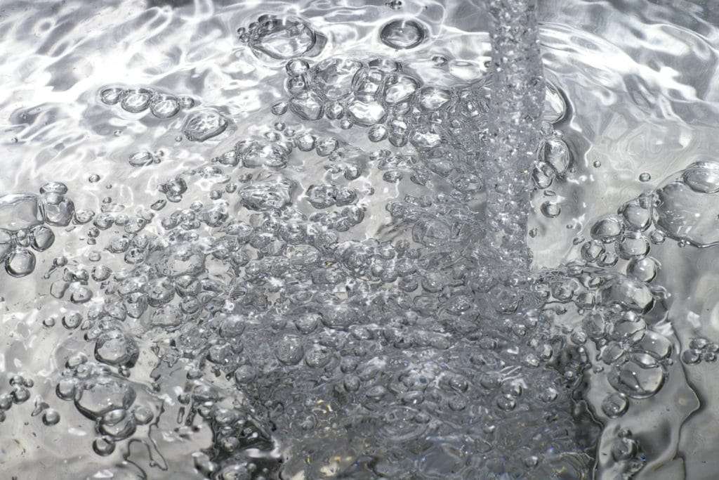 A tb being filled with water. Moving water.