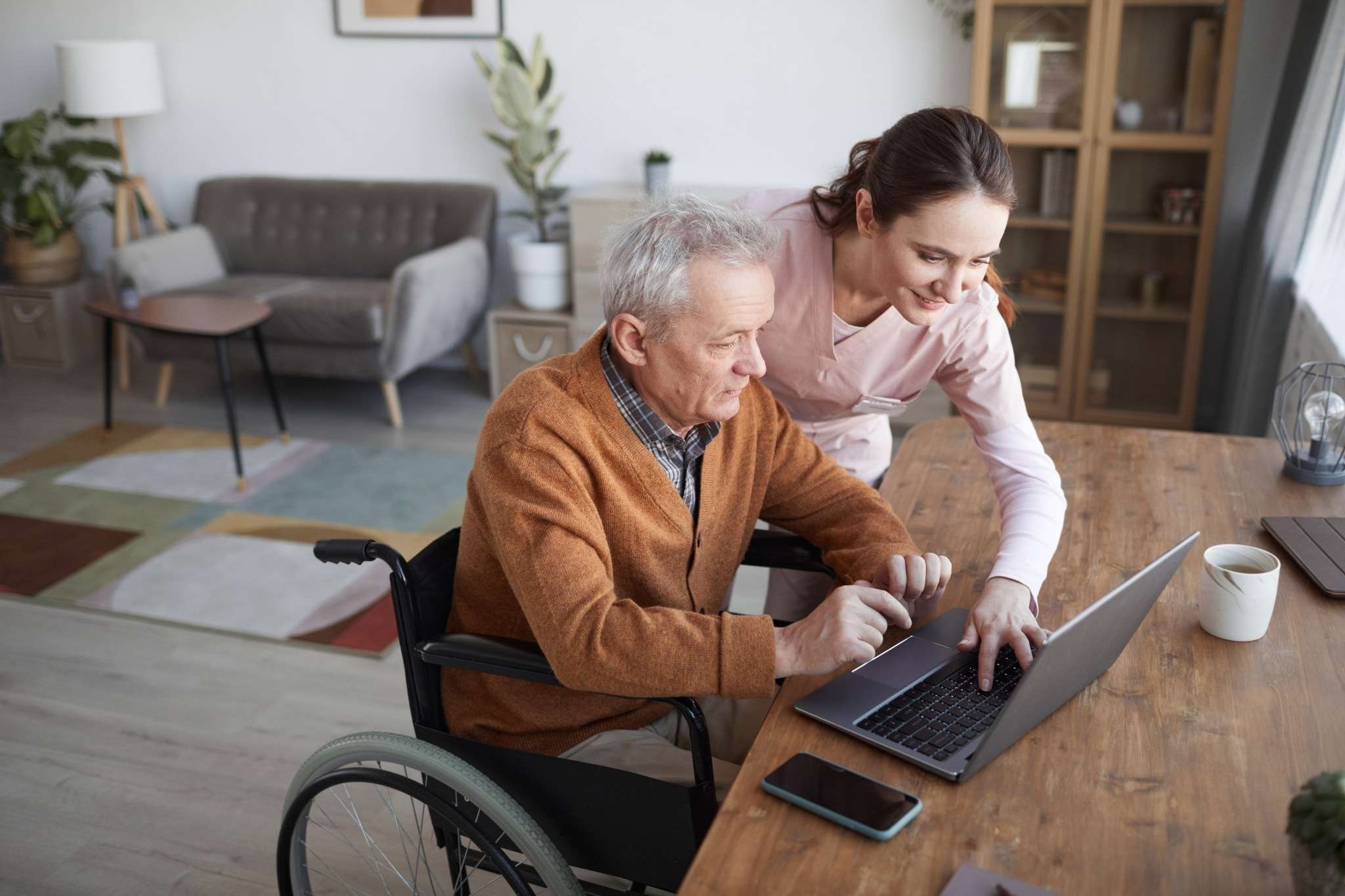 Contact 1 elderly person on computer with help from care professional